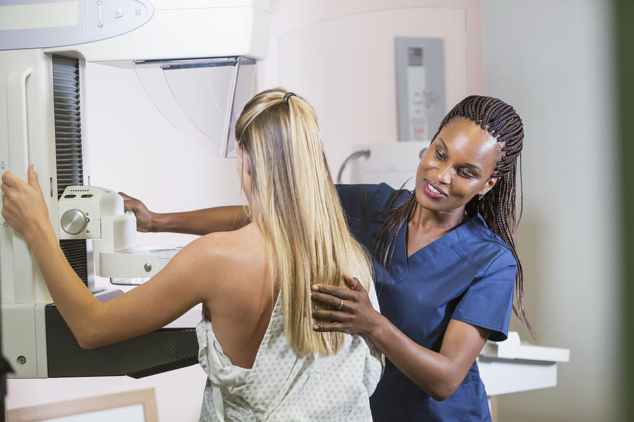 Woman getting mammogram Photograph by Kali9