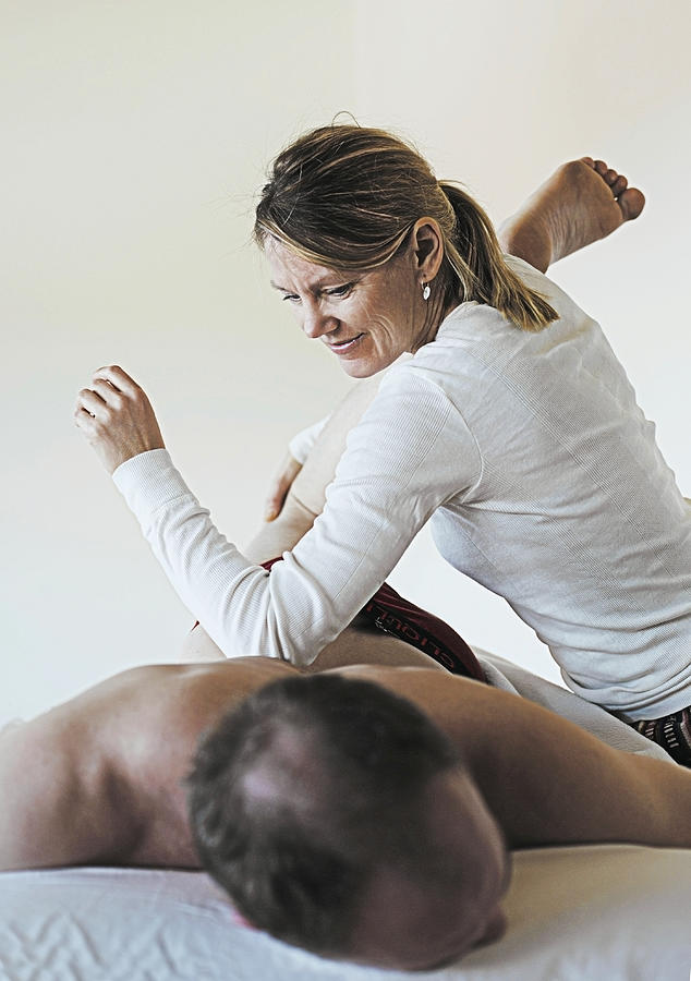 Woman giving healing massage. Photograph by David Trood