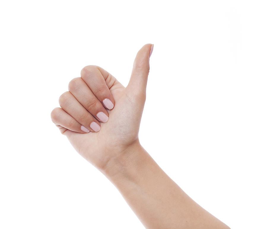 Woman hand showing Thumb up on white Photograph by Deepblue4you