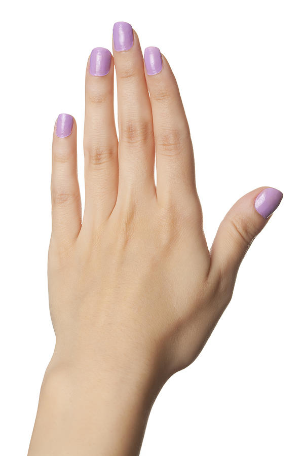 Woman hand with violet painted nails Photograph by RuslanDashinsky