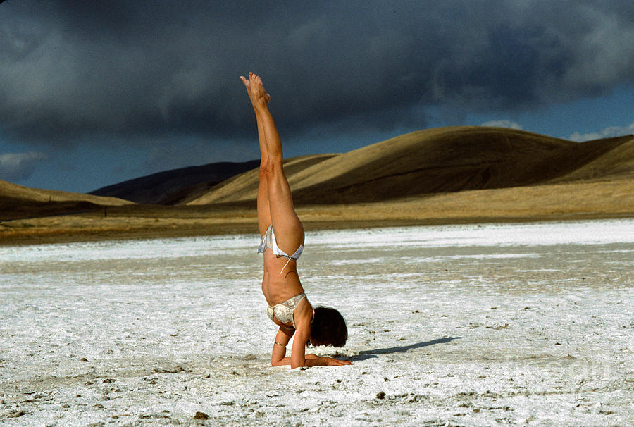 Woman Handstand on the Salt Flats of Carrizo Photograph by Wernher Krutein