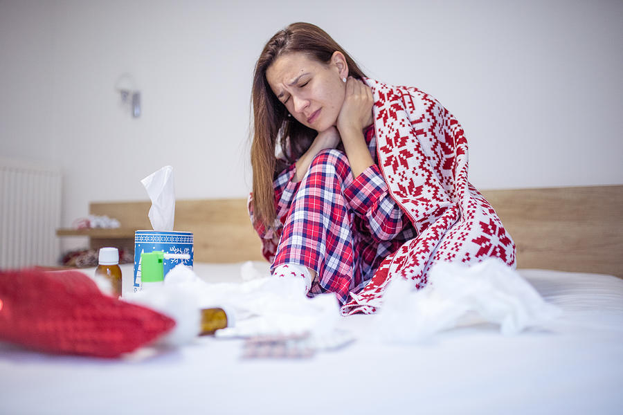 Woman has fever on christmas Photograph by South_agency