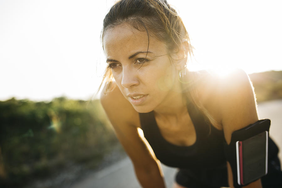 Woman having a break during workout Photograph by Jordi Salas Woman having a break during workout Photograph by Jordi Salas