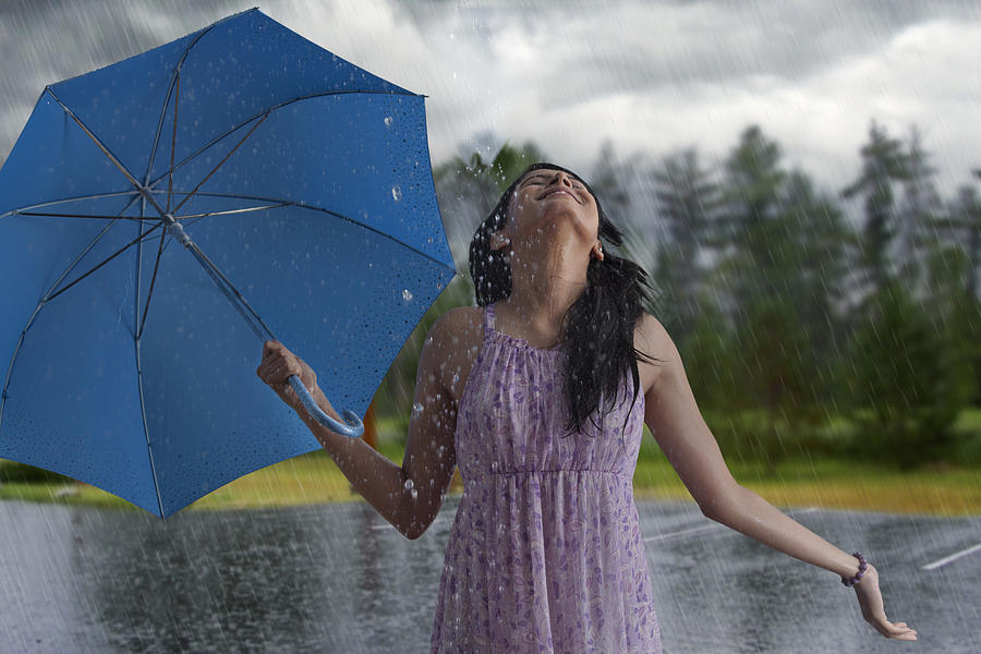Woman having fun in the rain Photograph by Abhinandita Mathur 