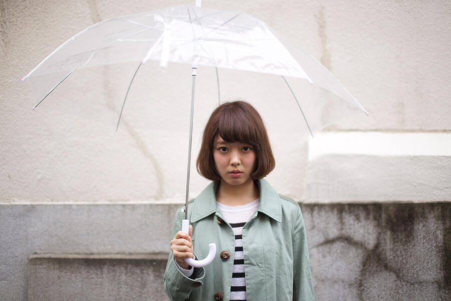 Woman having umbrella Photograph by Tadamasa Taniguchi