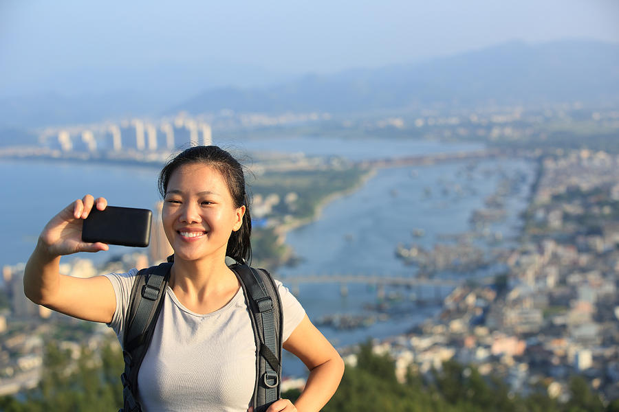 Woman Hiker Use Smart Phone Taking Self Photo Photograph by Lzf
