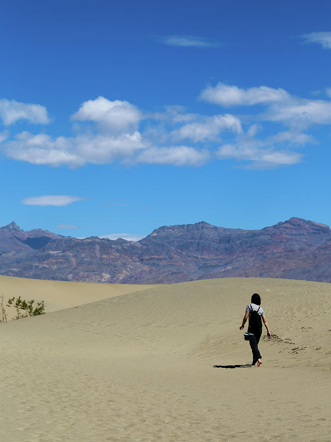 Woman hiking in Death Valley Np Photograph by Alberto Zanoni