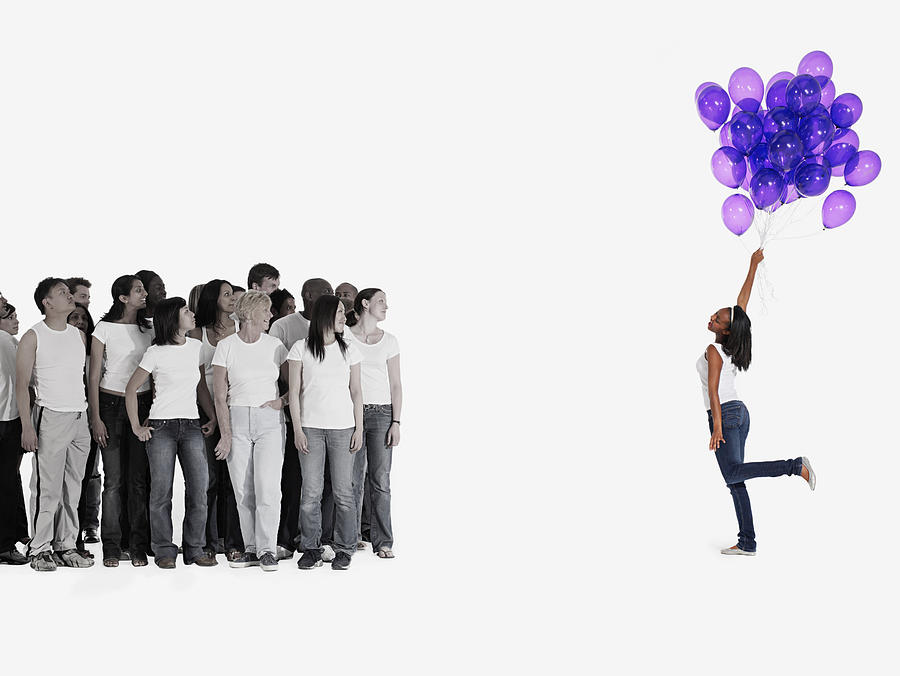 Woman holding balloons Photograph by Image Source