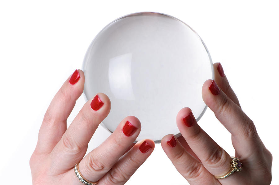 Woman holding crystal ball Photograph by OGphoto