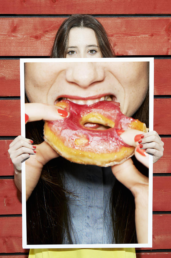 Woman Holding Picture Of Woman Eating Donut Photograph by Tara Moore