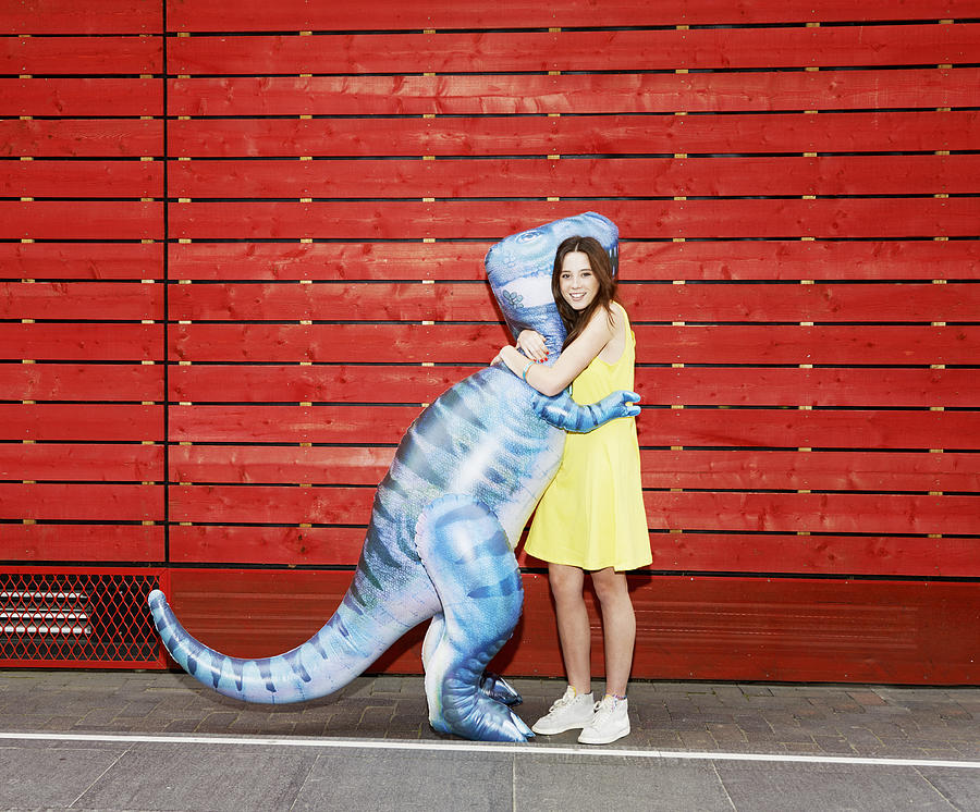 Woman Hugging Toy Dinosaur Photograph by Tara Moore