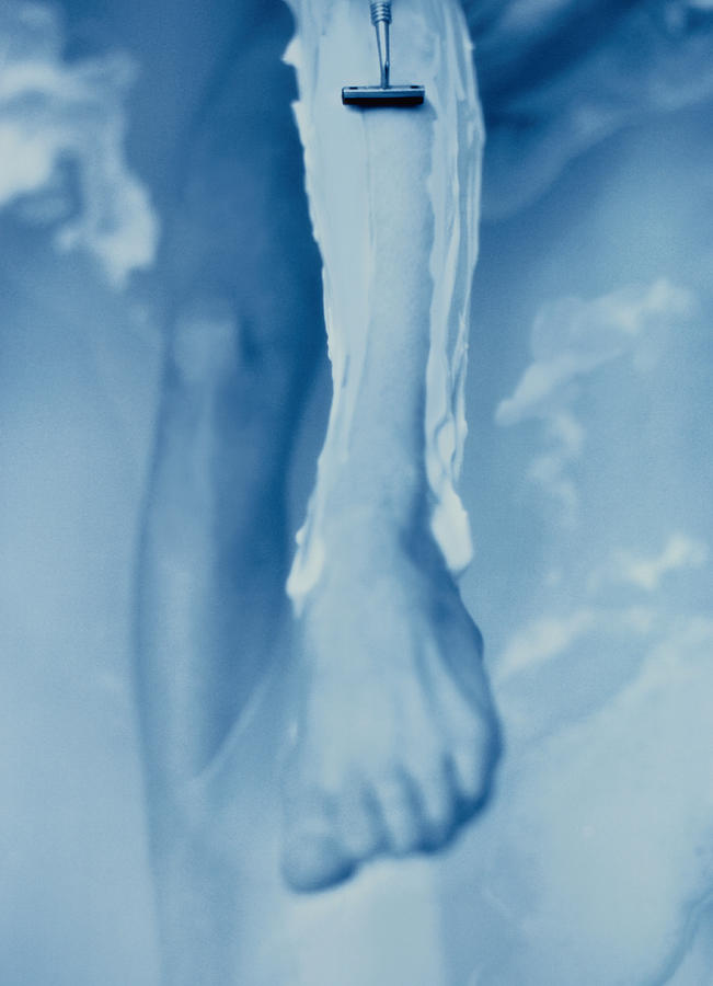Woman in Bath Shaving Leg Photograph by Paul Vozdic
