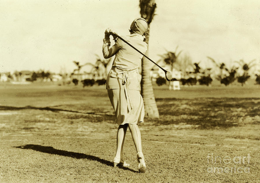 Hat Photograph - Woman in dress, cloche hat and medium heel shoes on a Miami Beach golf course, May 2, 1927 by American School