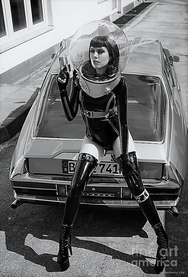 Woman in space age suit and sports car Photograph by Retrographs