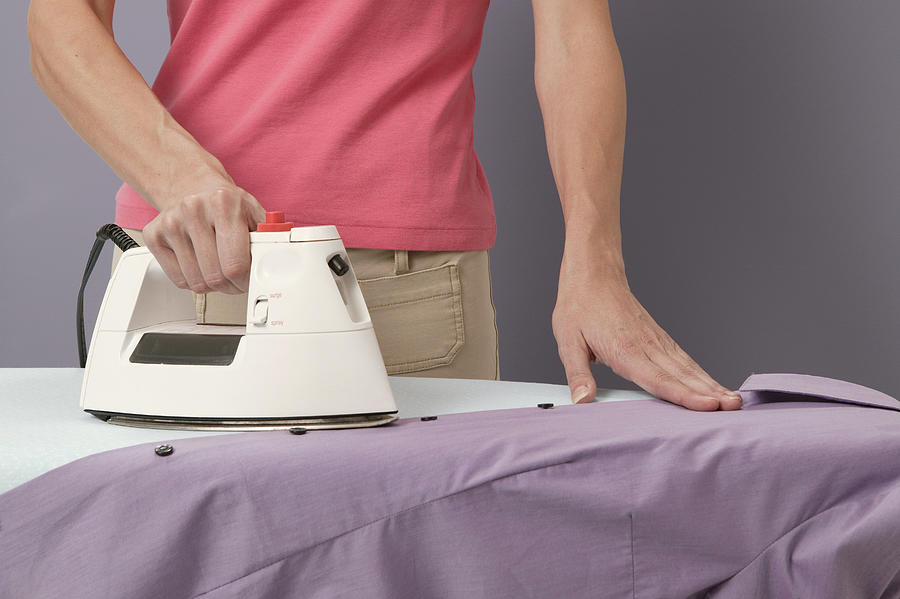 Woman ironing Photograph by Comstock Images