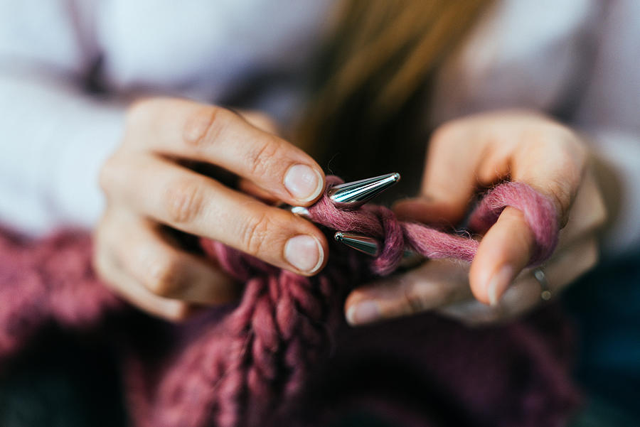 Woman knitting. Photograph by Guido Mieth