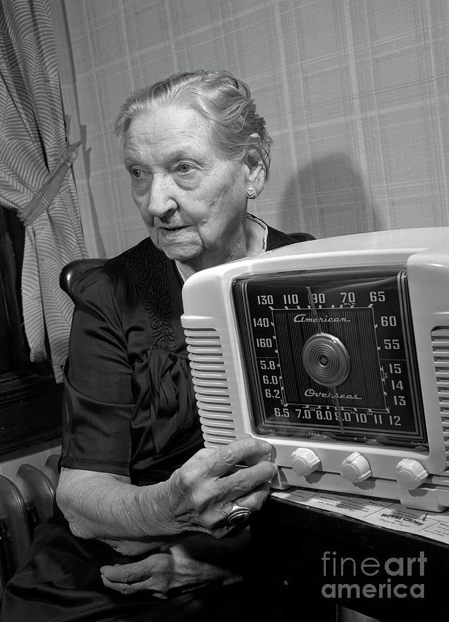 Woman listening to the radio 1943 Photograph by The Harrington Collection