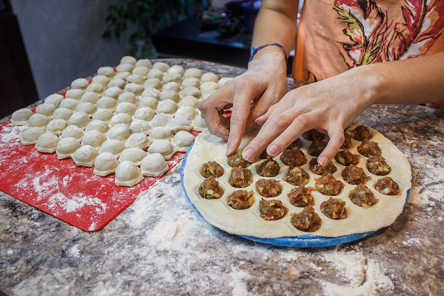 Woman Making Dumplings In Kitchen At Home Photograph by Tatiana Maramygina / FOAP