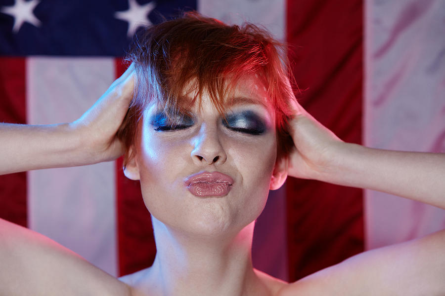 Woman Making Kiss Face American Flag Backdrop Photograph by Rebecca Handler