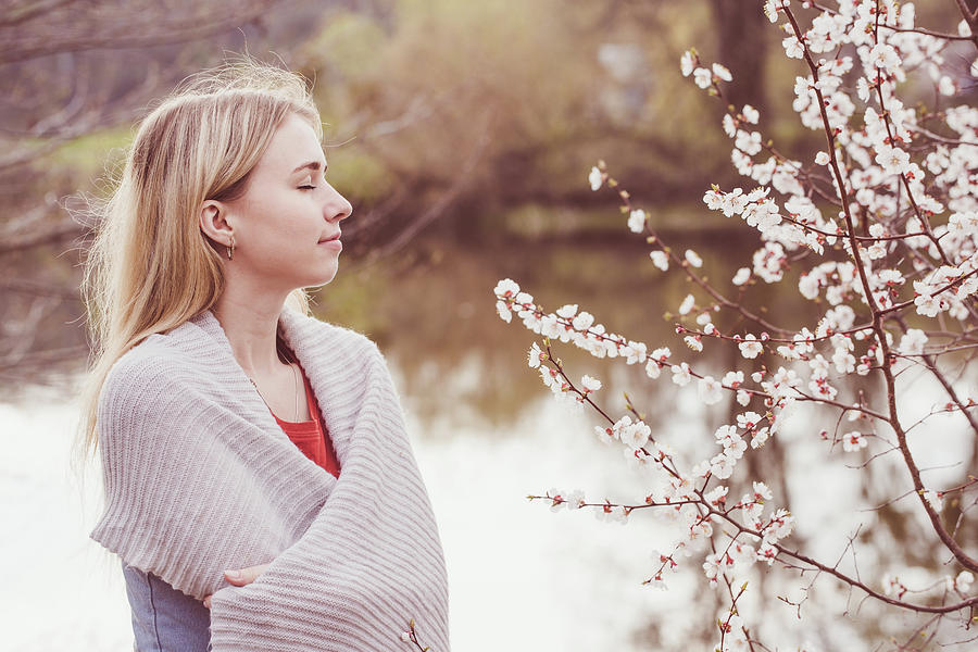 Woman Near The Blossoming Apricot Tree In Spring Photograph by Iuliia Malivanchuk