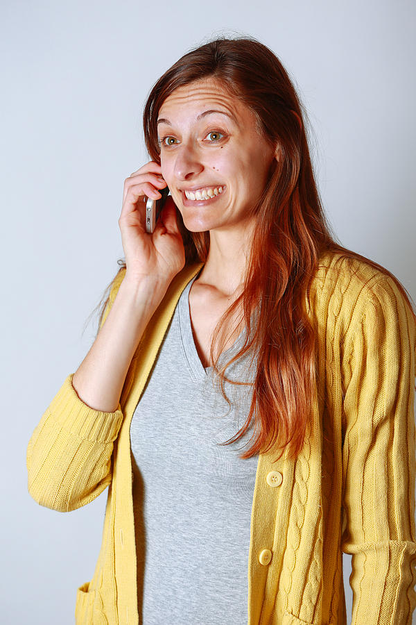 Woman on cell phone hearing good news Photograph by Jena Ardell