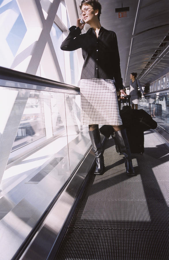 Woman on Moving Walkway Photograph by White Packert