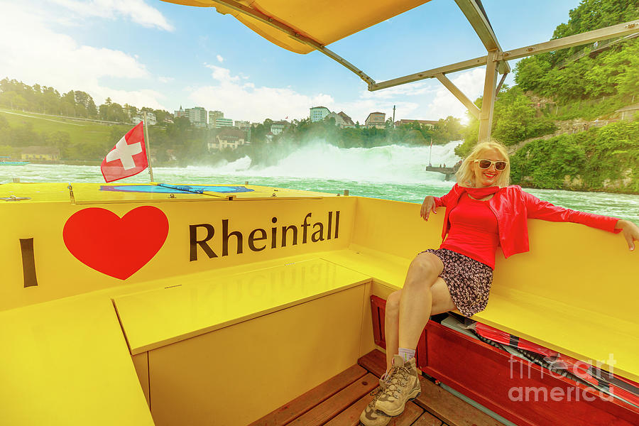 woman on the boat to Rhine Falls waterfall Photograph by Benny Marty