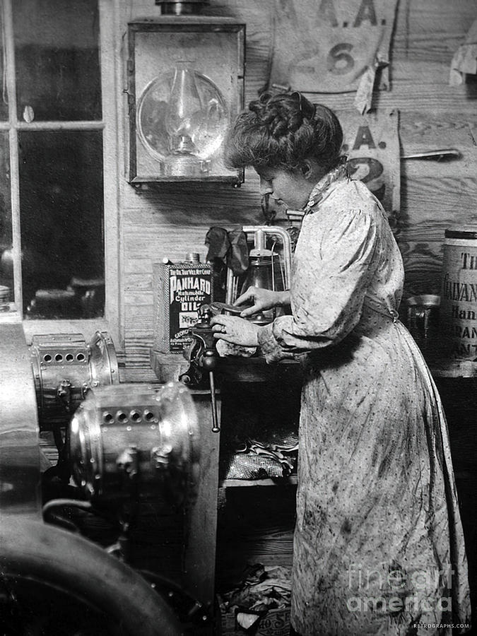 Woman polishing early vehicle headlamps 1910 Photograph by Retrographs