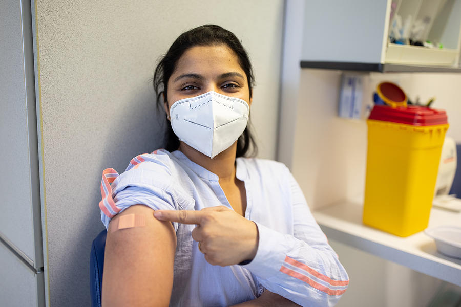 Woman proud to have received vaccine Photograph by Luis Alvarez