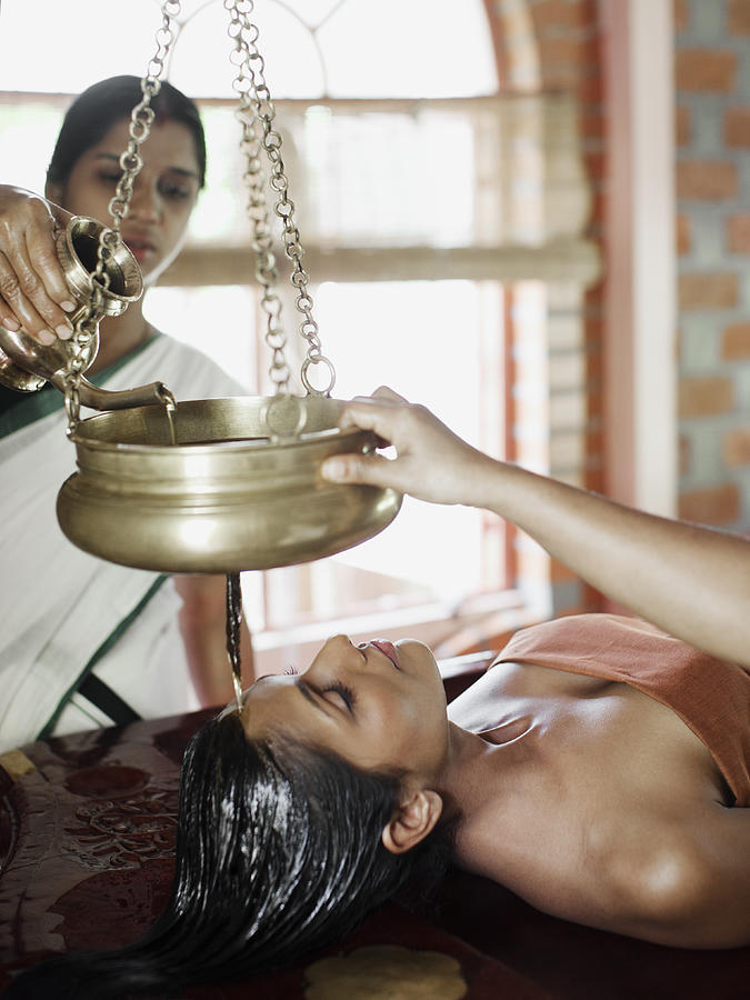 Woman Receiving Shirodhara Ayurvedic Treatment Photograph by Matthew Wakem Woman Receiving Shirodhara Ayurvedic Treatment Photograph by Matthew Wakem