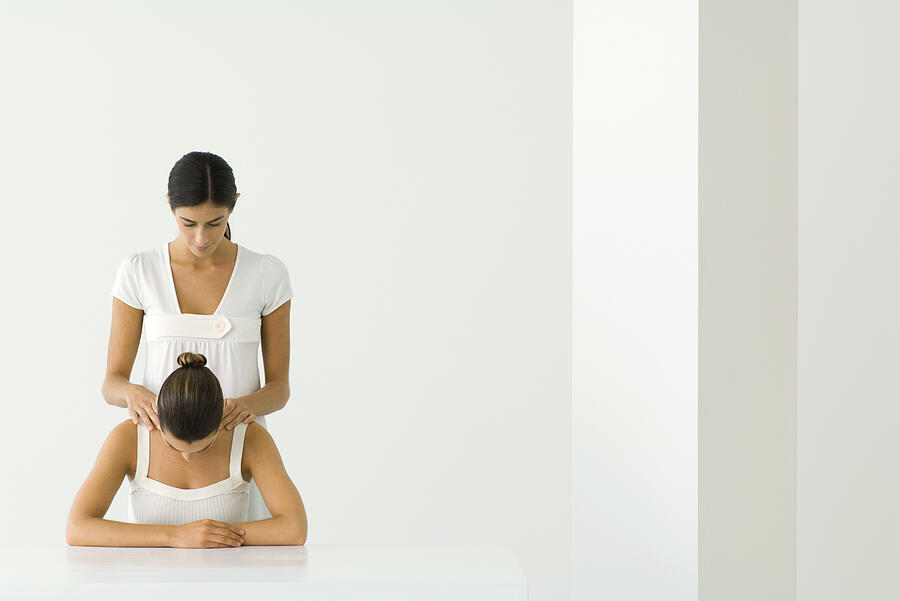 Woman receiving shoulder massage Photograph by ZenShui/Milena Boniek