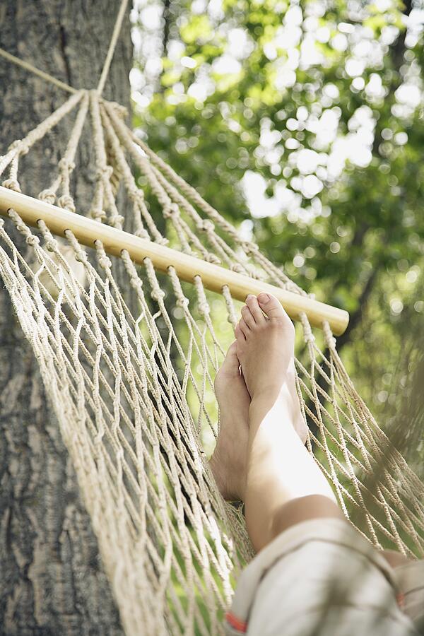Woman relaxing on hammock Photograph by Tammy Hanratty