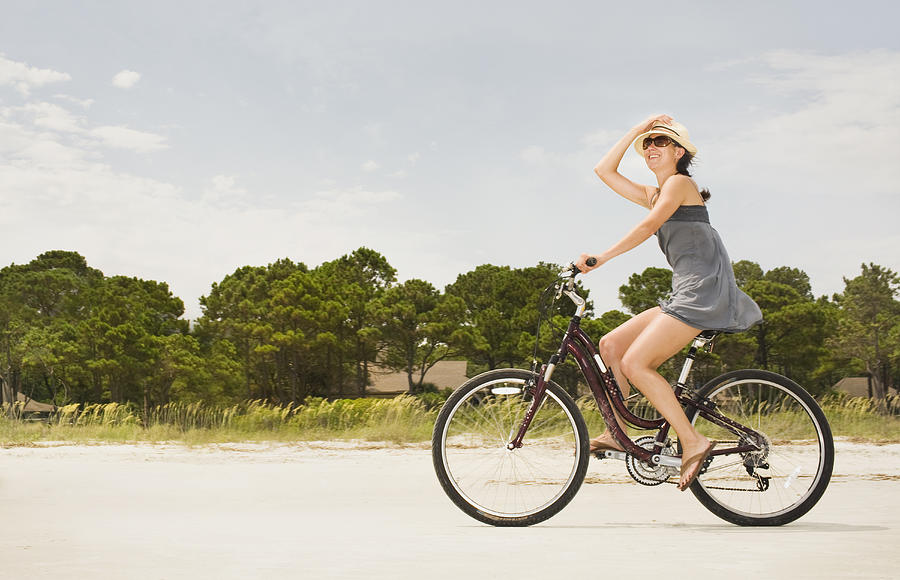 Woman Riding Bike Along Beach. Photograph by Frank Gaglione