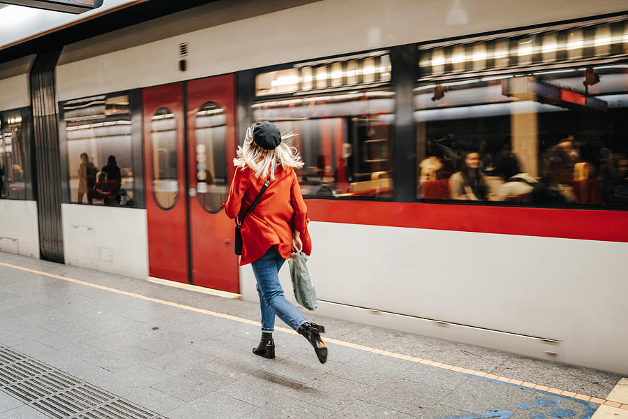 Woman running to catch the train Photograph by Bojanstory