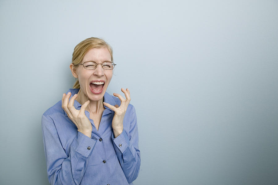 Woman screaming Photograph by Comstock Images
