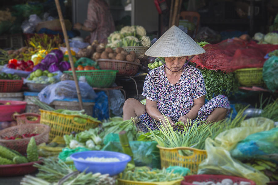 Woman selling vegetables in Hue market, Vietnam Photograph by Gargolas
