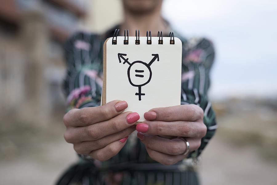 Woman Shows Notepad With A Transgender Symbol Photograph by Nito100