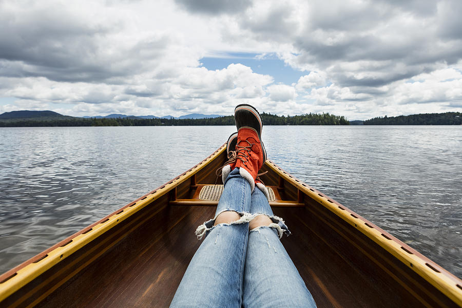 Woman sitting in canoe POV looking out Photograph by Nisian Hughes