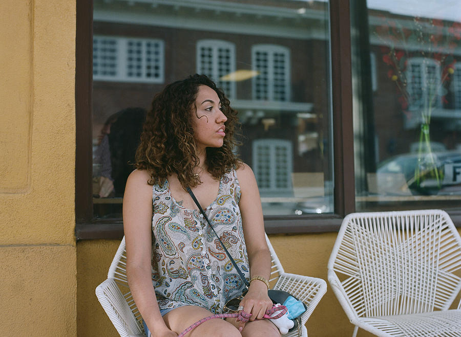 Woman sitting outside cafe Photograph by Scott Zdon