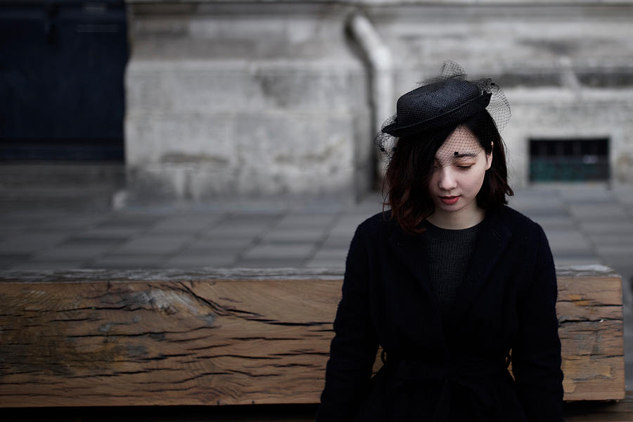 Woman sitting with black fashion Photograph by Tadamasa Taniguchi