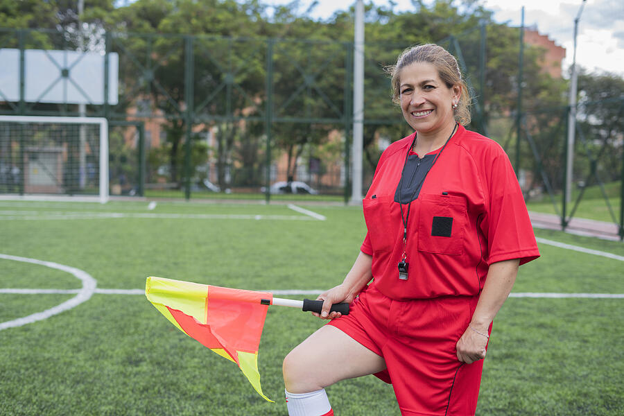 Woman soccer referee looks at the camera while starting the match Photograph by RicardoImagen