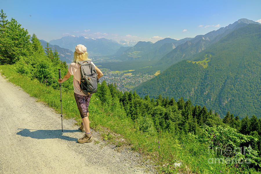 Woman trekking on Brambruesch in Switzerland Photograph by Benny Marty