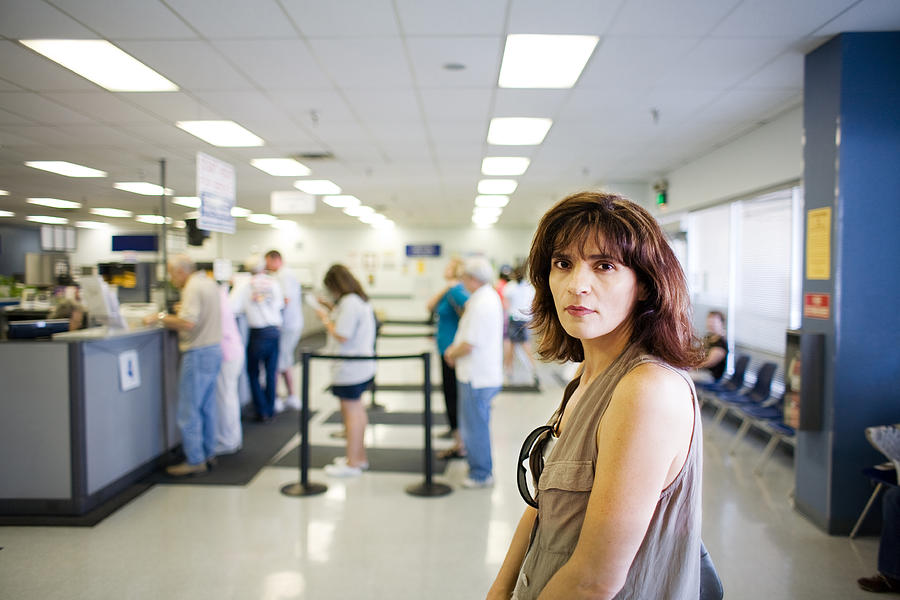 Woman Waiting in Line Photograph by Slobo