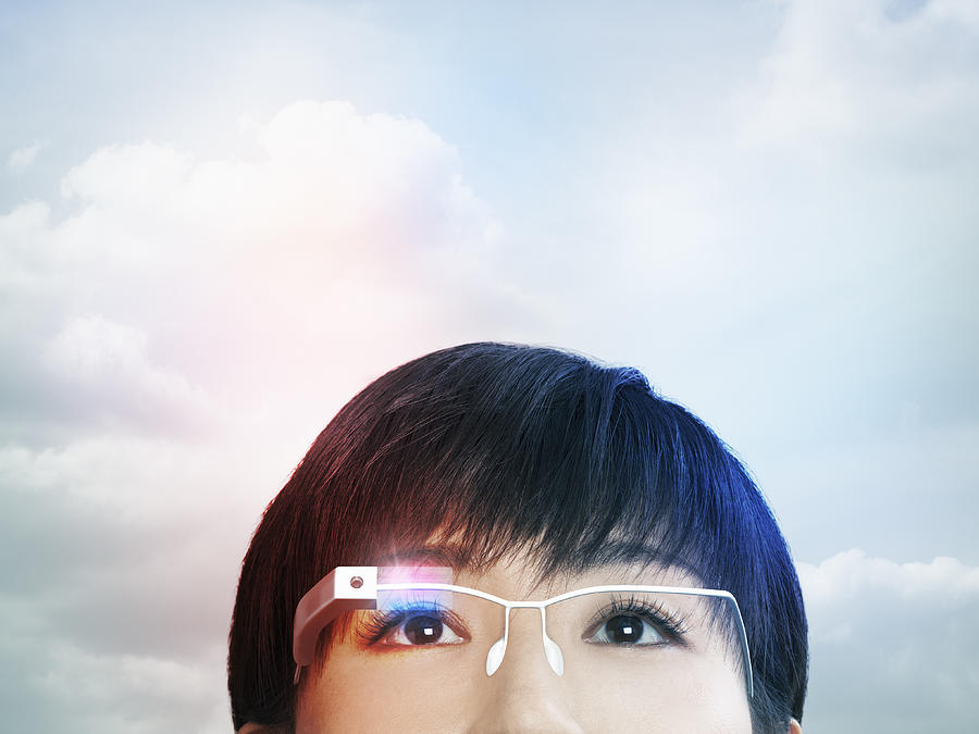 Woman wearing a smart glasses Photograph by Hiroshi Watanabe
