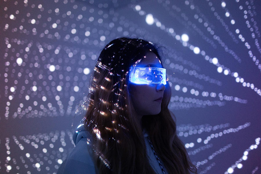 Woman wearing augmented reality glasses at night Photograph by Qi Yang