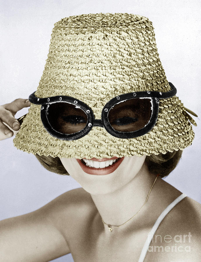 Woman with a big straw hat putting her sunglasses on the hat Photograph by European School