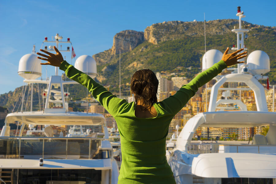 Woman with Arms Outstretched Over Monte Carlo and the Port Photograph by Mats Silvan