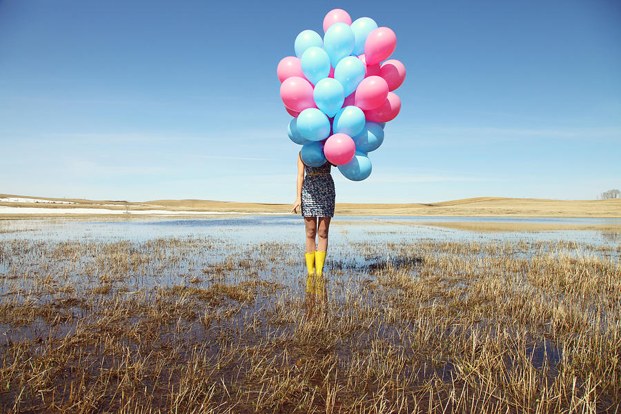 Woman With Balloons In Spring Field Photograph by Lori Andrews