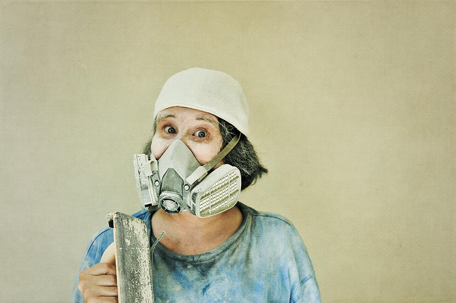 Woman with drywall sanding tool Photograph by Susan McDougall Photography