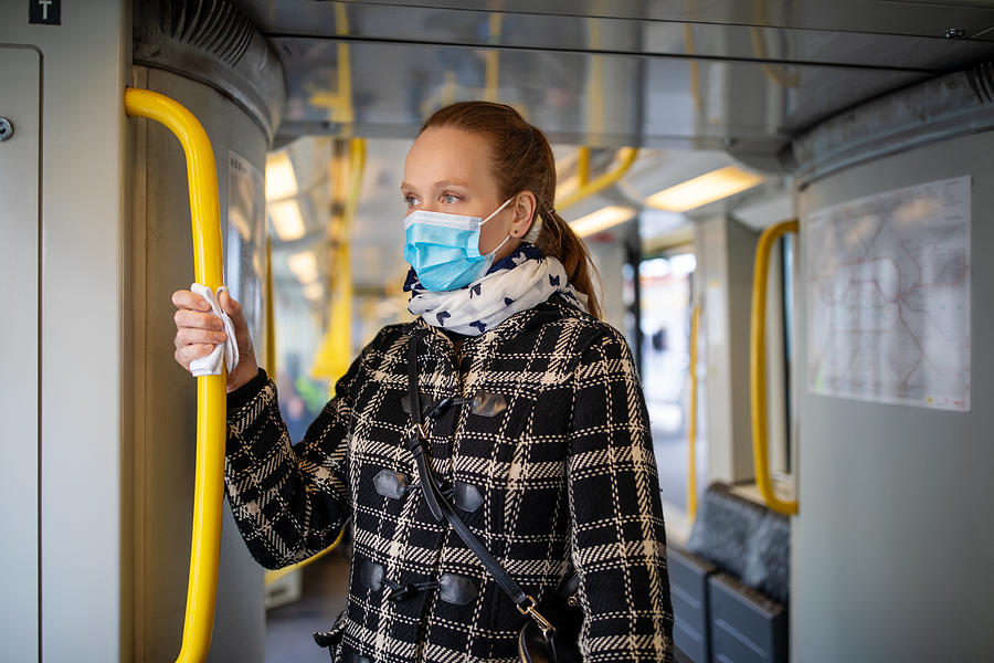 Woman with face mask travelling in metro during Covid-19 outbreak Photograph by Alvarez